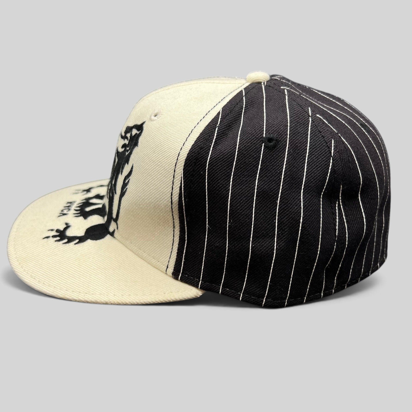 Raree Finds RVCA black and white pinstripe wool blend fitted hat with a crest graphic on the front panel