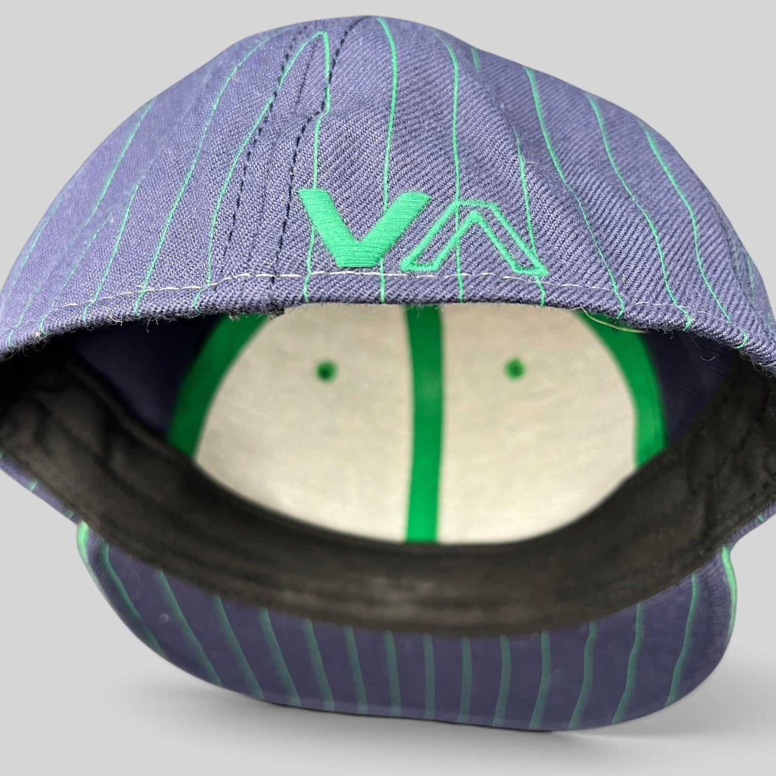 Raree Finds vintage RVCA snapback hat featuring a blue pinstripe crown with green VA logo embroidery