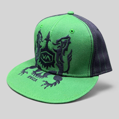 Raree Finds vintage RVCA snapback hat in green and black with a lion crest logo and pinstripe brim detail.