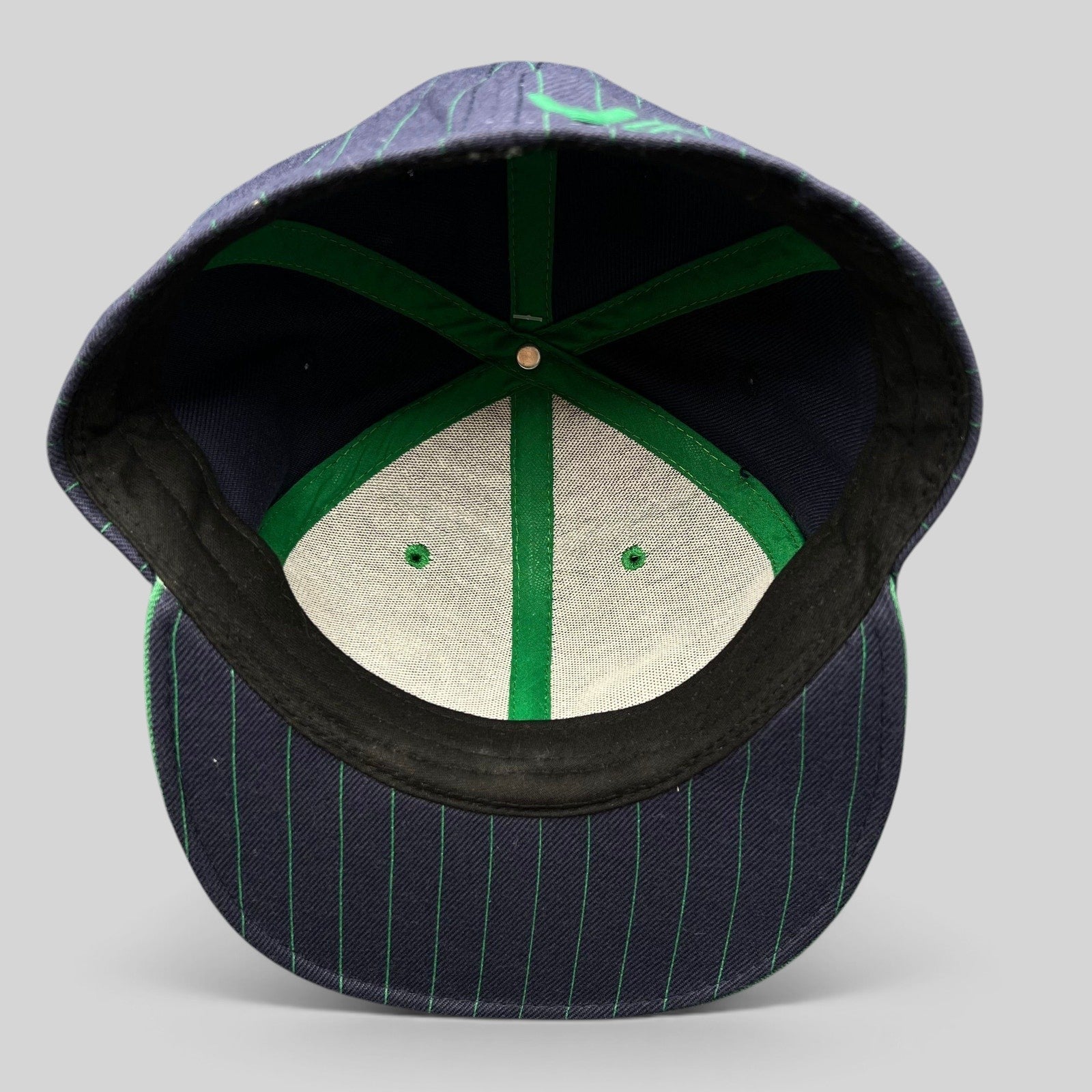 Raree Finds vintage RVCA Y2K snapback hat interior view showing green taped seams and black pinstripe brim detail
