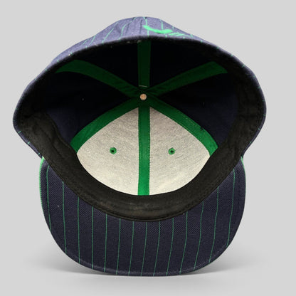 Raree Finds vintage RVCA Y2K snapback hat interior view showing green taped seams and black pinstripe brim detail