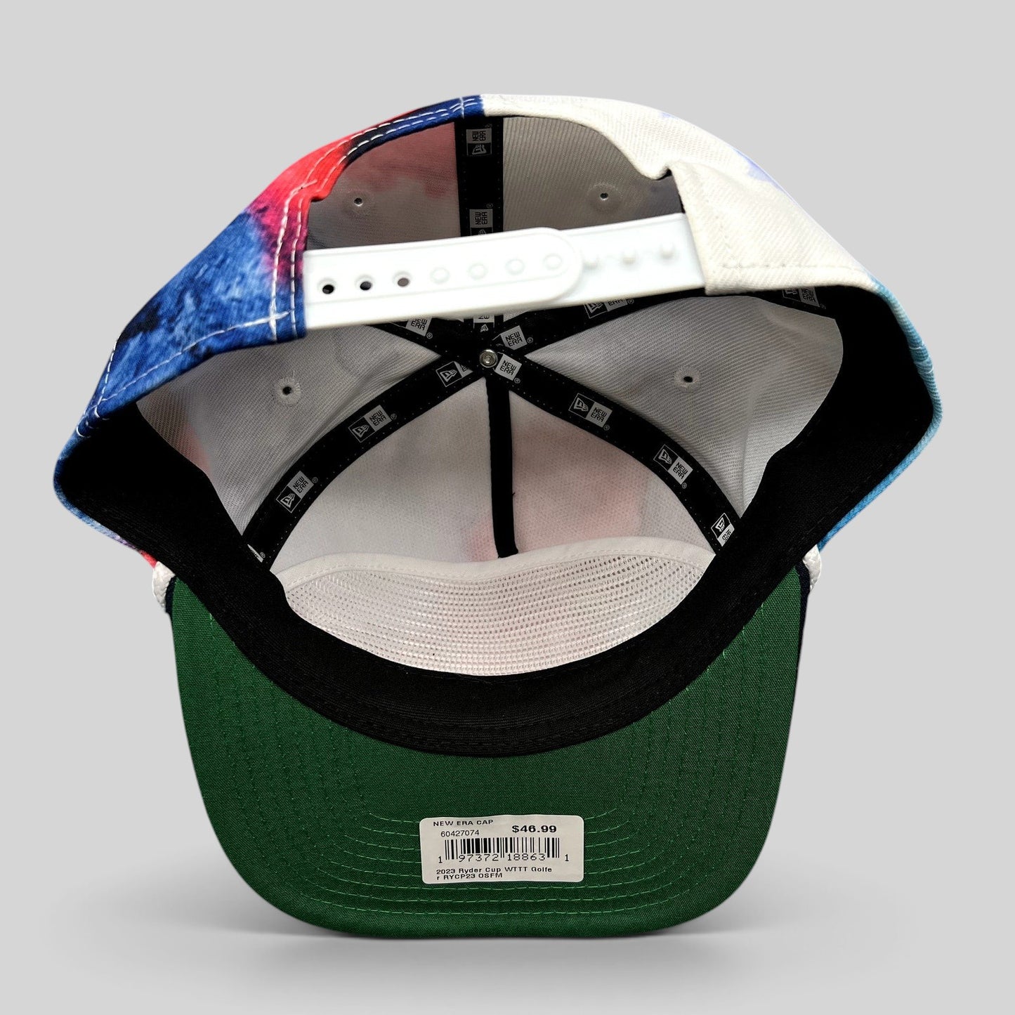 Raree Finds 2023 Ryder Cup Team USA snapback hat interior view showing green undervisor and New Era branding tape.