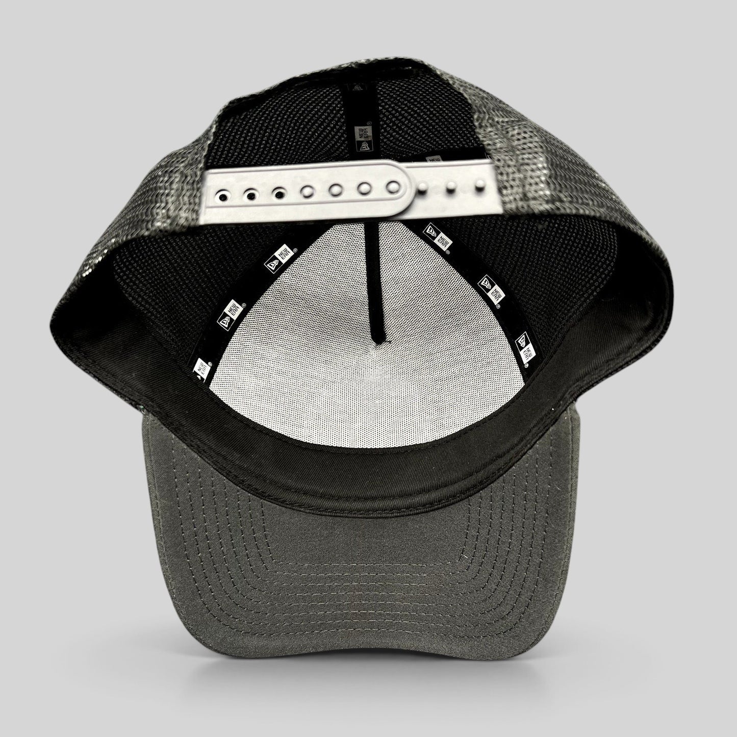 Raree Finds 2023 Ryder Cup New Era snapback trucker hat showing the interior construction and adjustable strap