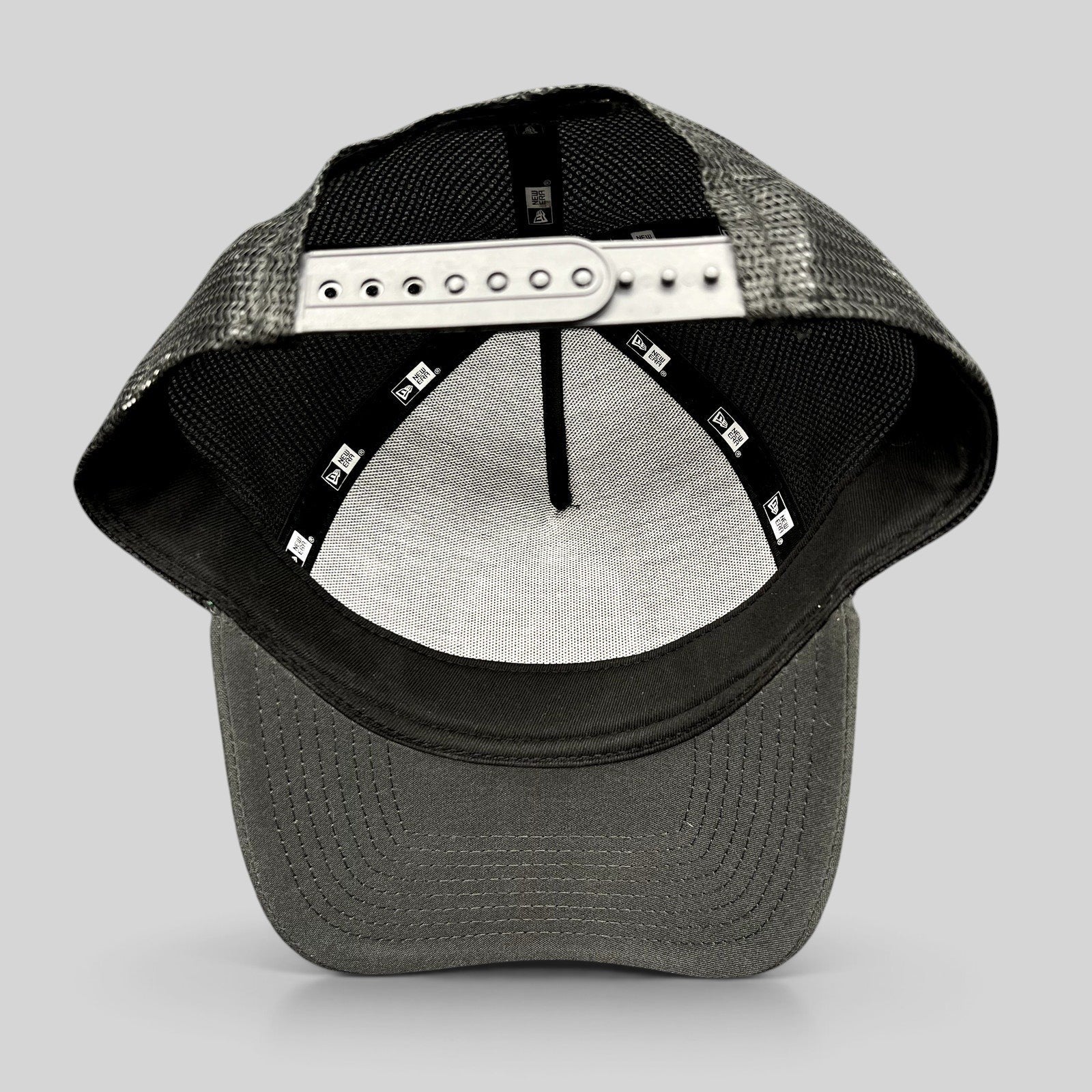 Raree Finds 2023 Ryder Cup New Era snapback trucker hat showing the interior construction and adjustable strap
