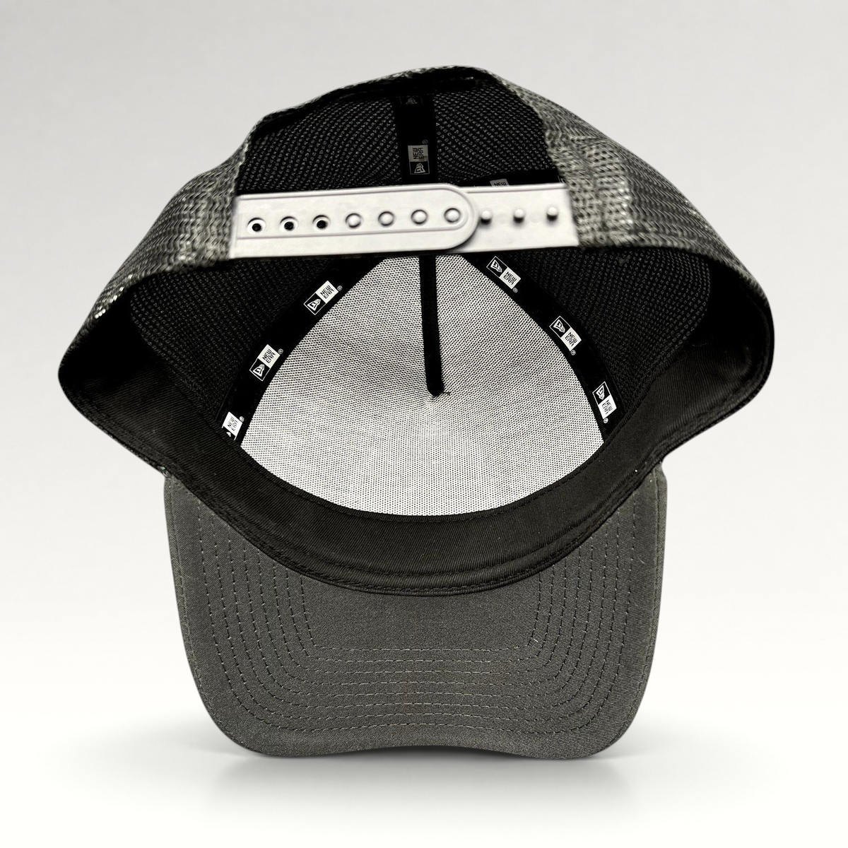 Raree Finds 2023 Ryder Cup New Era snapback trucker hat showing the interior construction and adjustable strap