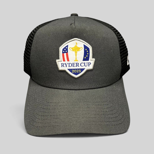 Raree Finds 2023 Ryder Cup New Era snapback trucker hat in charcoal gray and black with embroidered tournament logo
