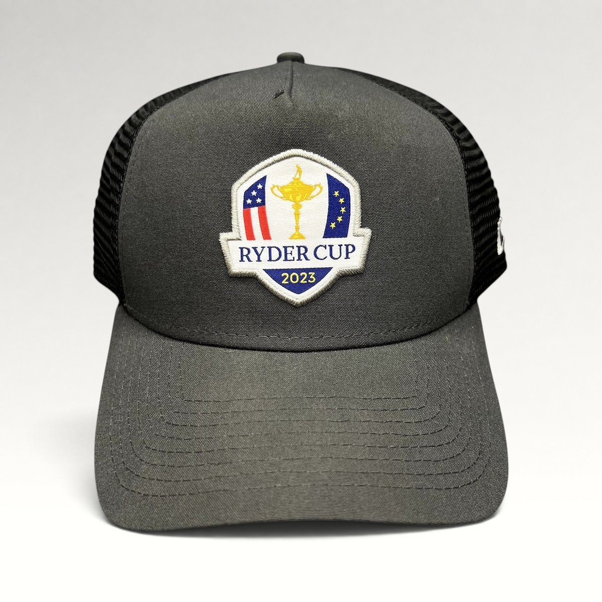 Raree Finds 2023 Ryder Cup New Era snapback trucker hat in charcoal gray and black with embroidered tournament logo