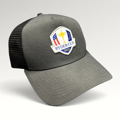Raree Finds 2023 Ryder Cup snapback trucker hat in charcoal gray with black mesh back and embroidered tournament logo