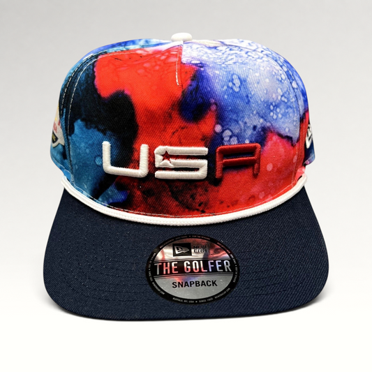 Raree Finds 2023 Ryder Cup Team USA snapback hat featuring a red, white, and blue watercolor crown and navy brim.