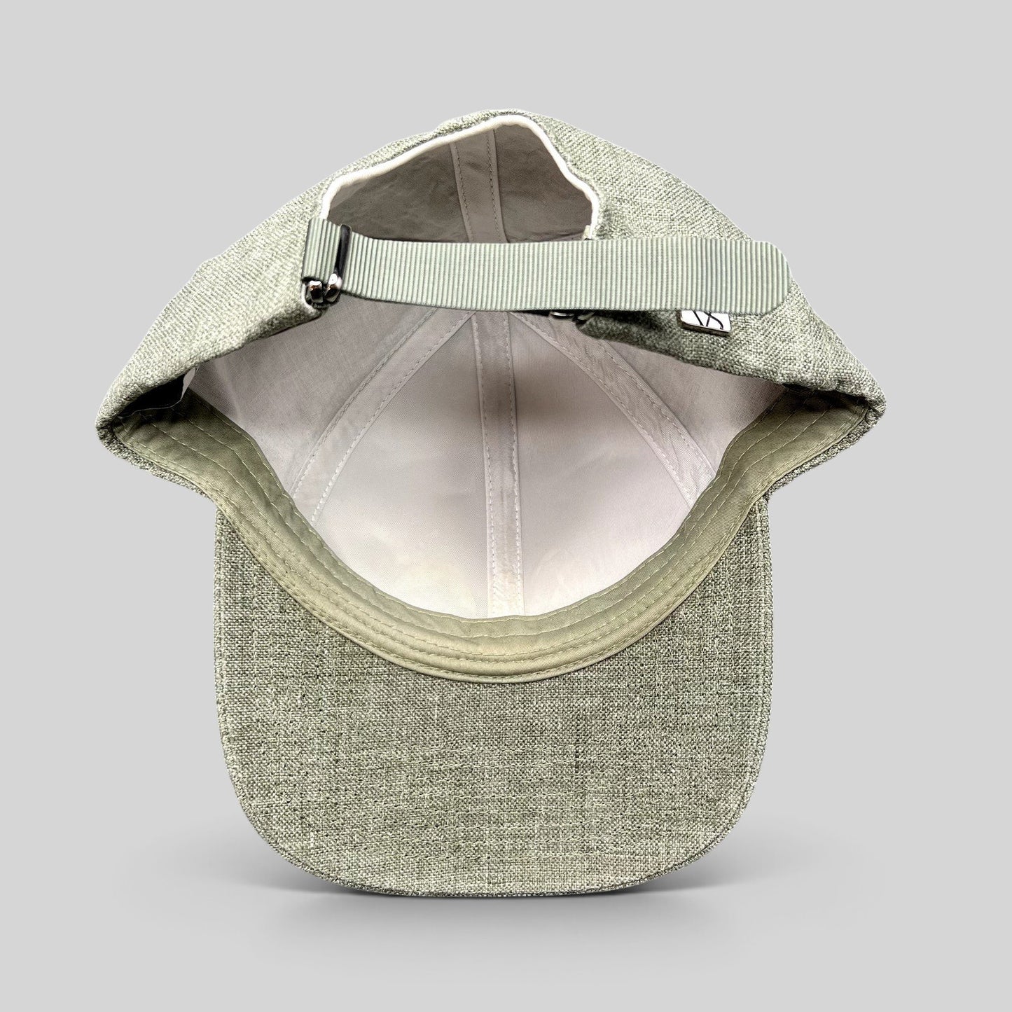 Raree Finds sage green Angelico Italian linen strapback cap with adjustable fabric strap and metal hardware