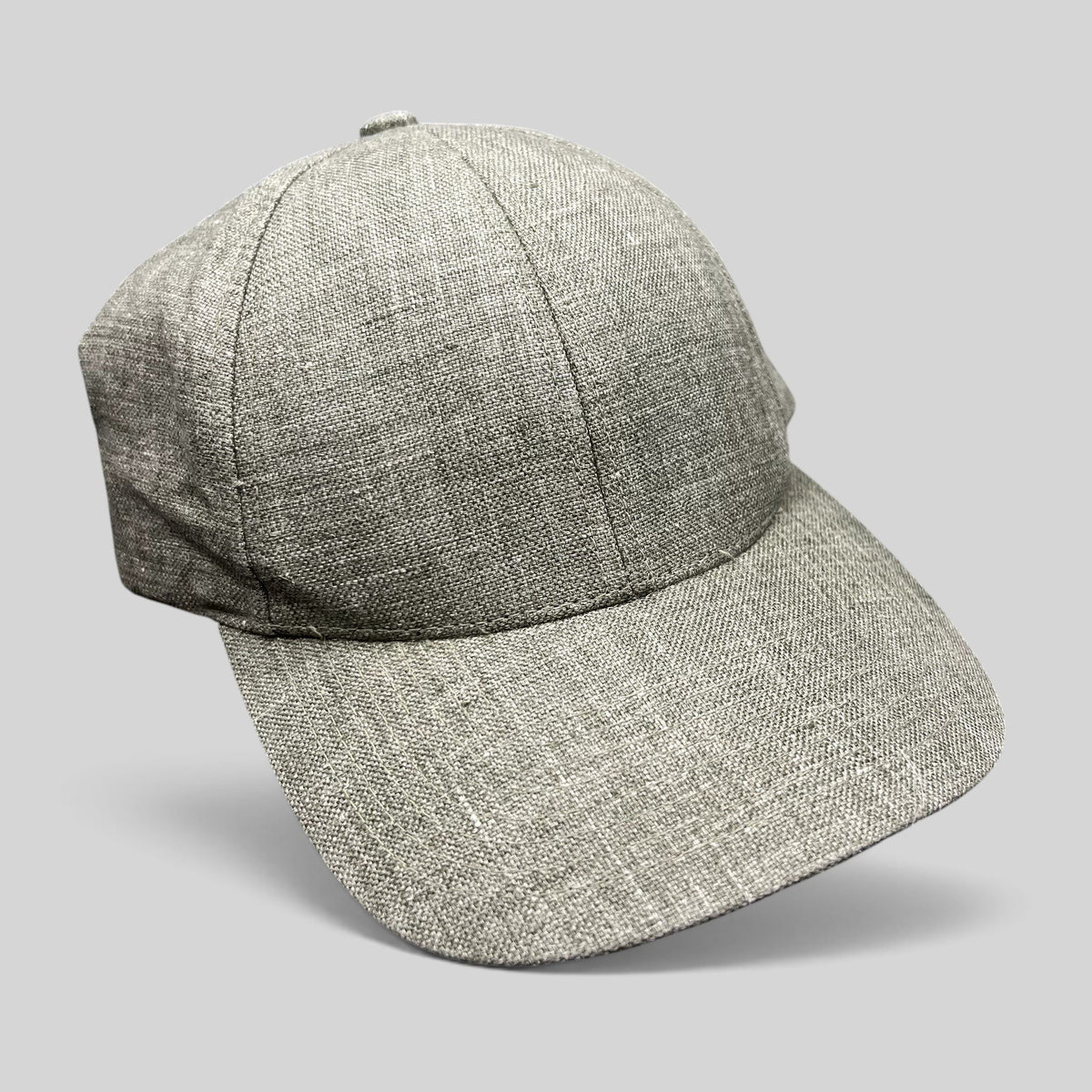 Raree Finds sage green Angelico Italian linen strapback cap with an unstructured profile and minimalist design.