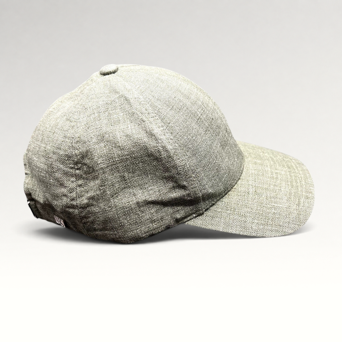 Raree Finds sage green Angelico Italian linen strapback cap with an unstructured profile and minimalist design.
