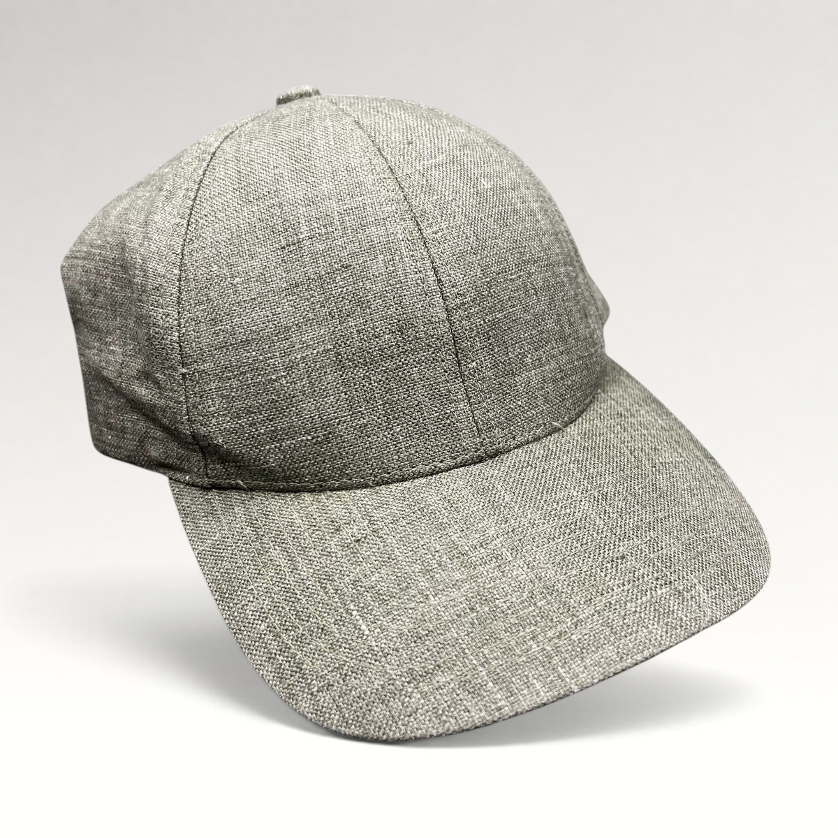 Raree Finds sage green Angelico Italian linen strapback cap with an unstructured profile and minimalist design.