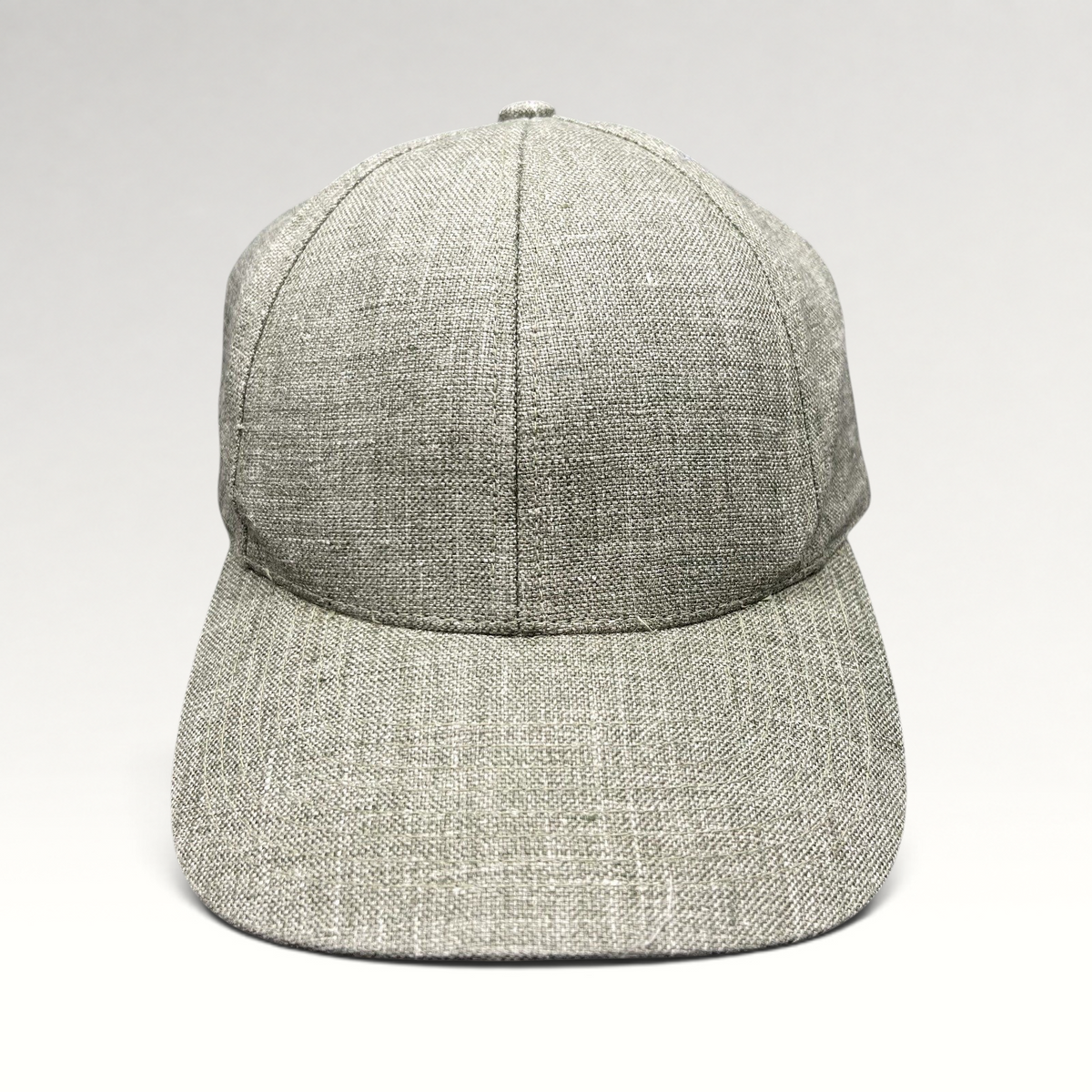 Raree Finds sage green Angelico Italian linen strapback cap with an unstructured profile and minimalist design.