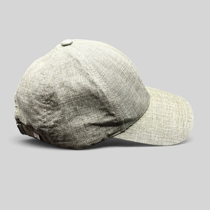 Raree Finds sage green Angelico Italian linen strapback cap with an unstructured profile and metal hardware