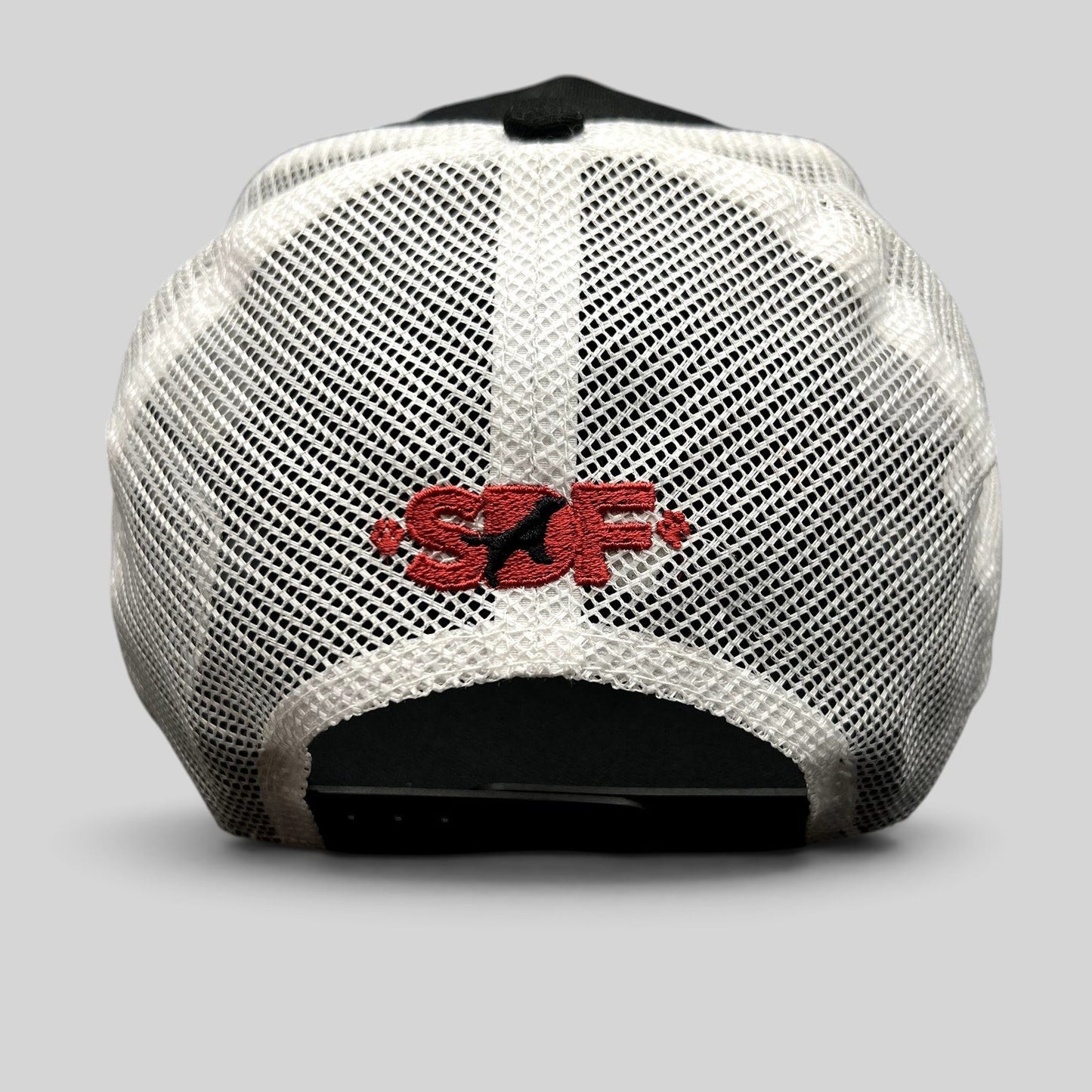 Raree Finds New Era 9FORTY trucker hat back view featuring white mesh panels and red embroidered SDF logo