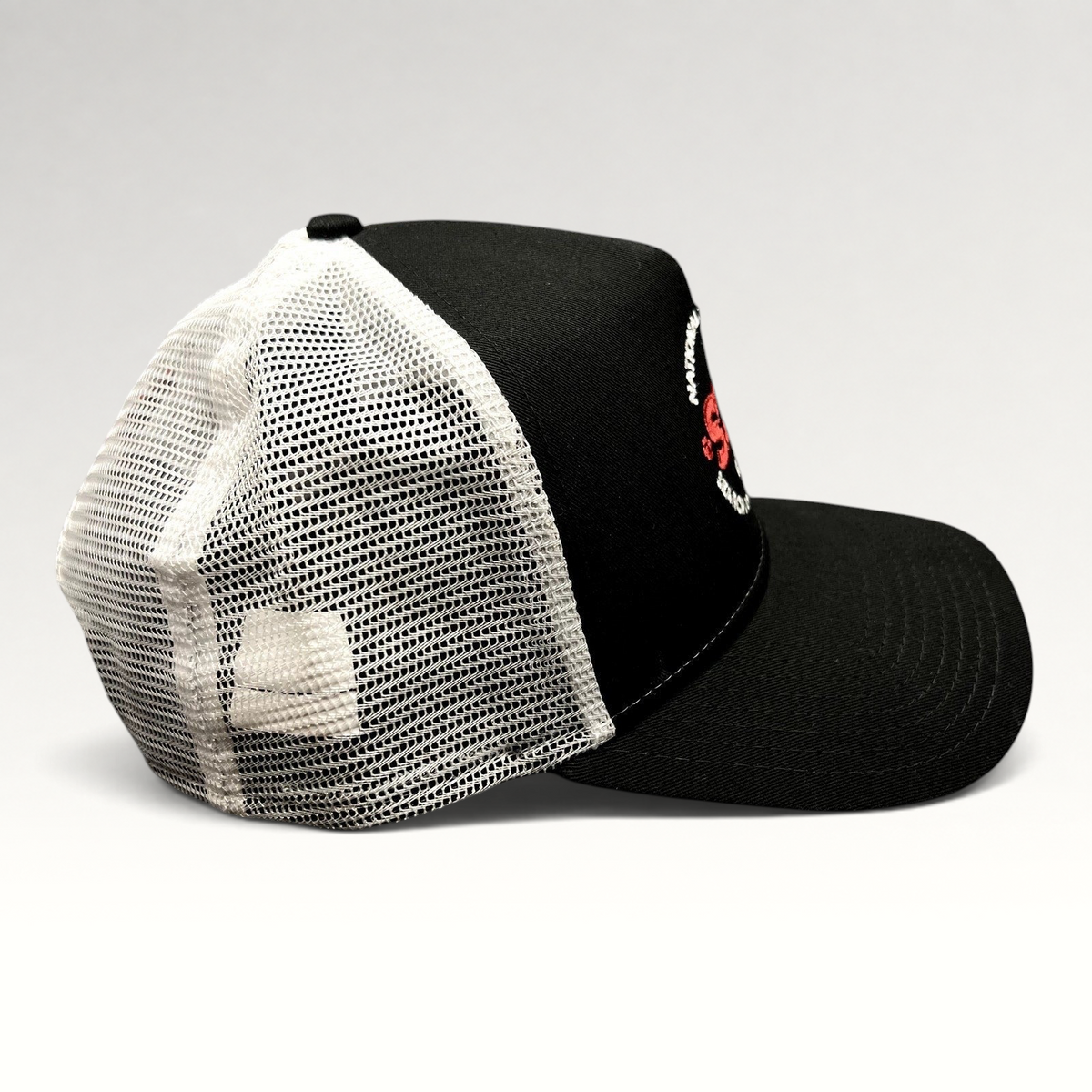 Raree Finds New Era 9FORTY SDF trucker snapback hat in black and white with an embroidered search dog foundation logo.