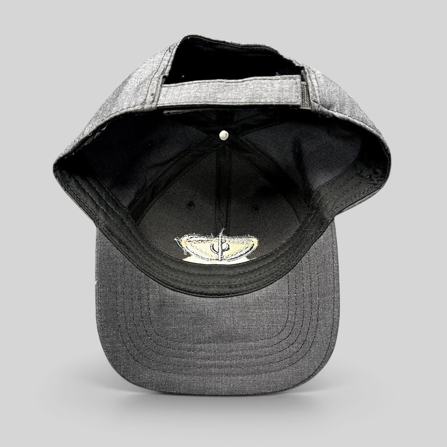 Raree Finds vintage sun-faded black cotton strapback hat with Sedona Arizona embroidered logo interior detail