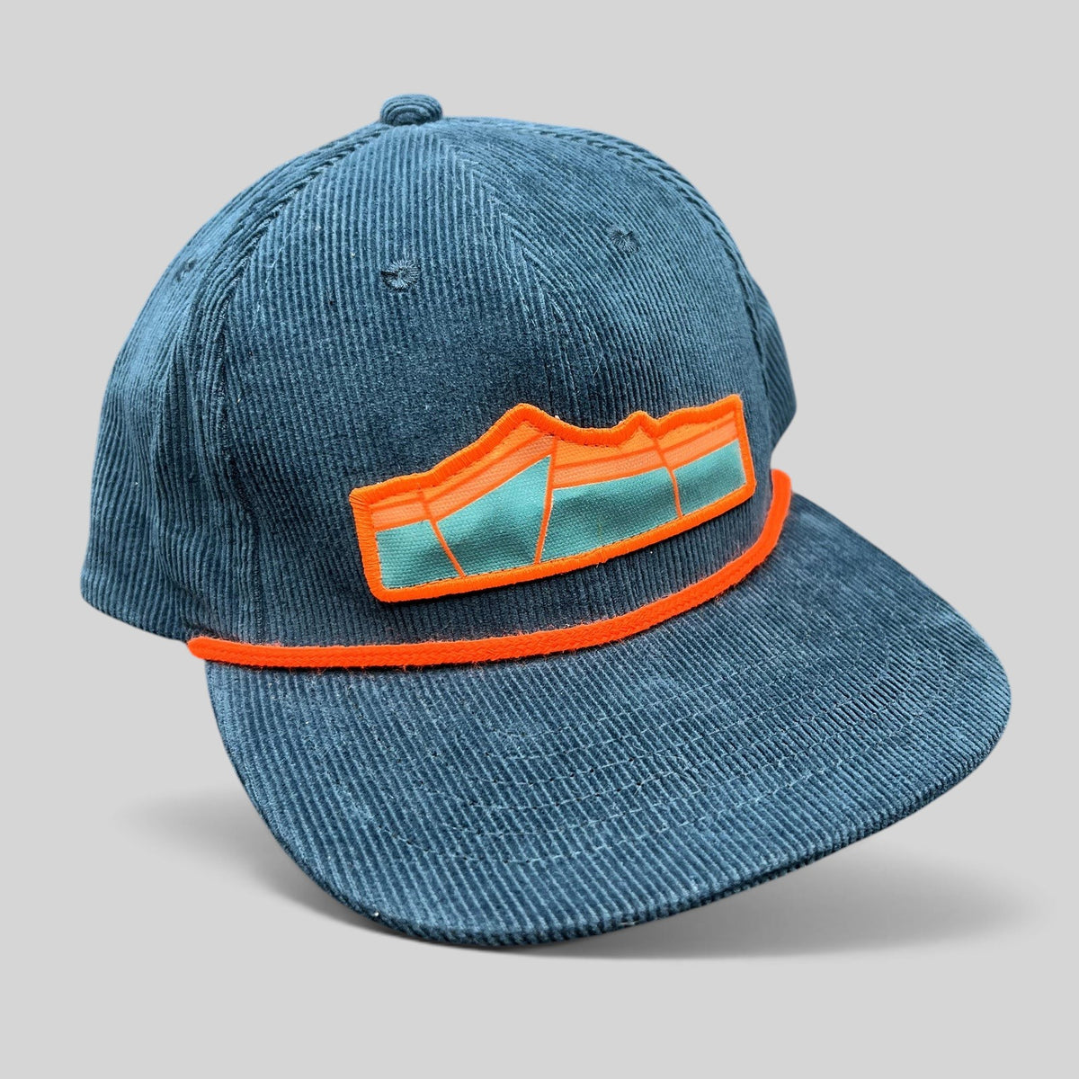 Raree Finds Sendero Provisions Co blue corduroy snapback hat with orange rope trim and mountain graphic patch