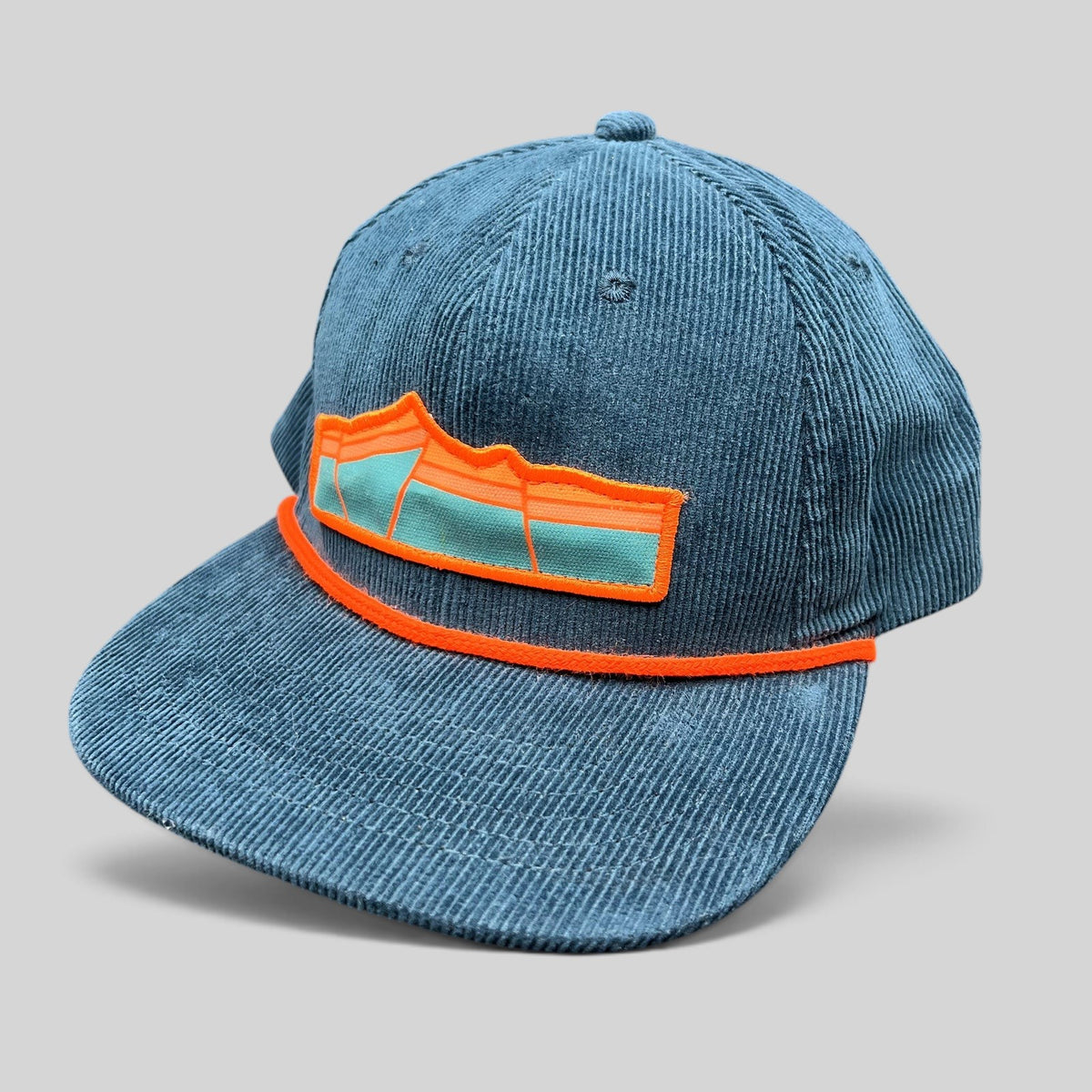 Raree Finds Sendero Provisions Co blue corduroy snapback hat with orange rope detail and mountain patch logo