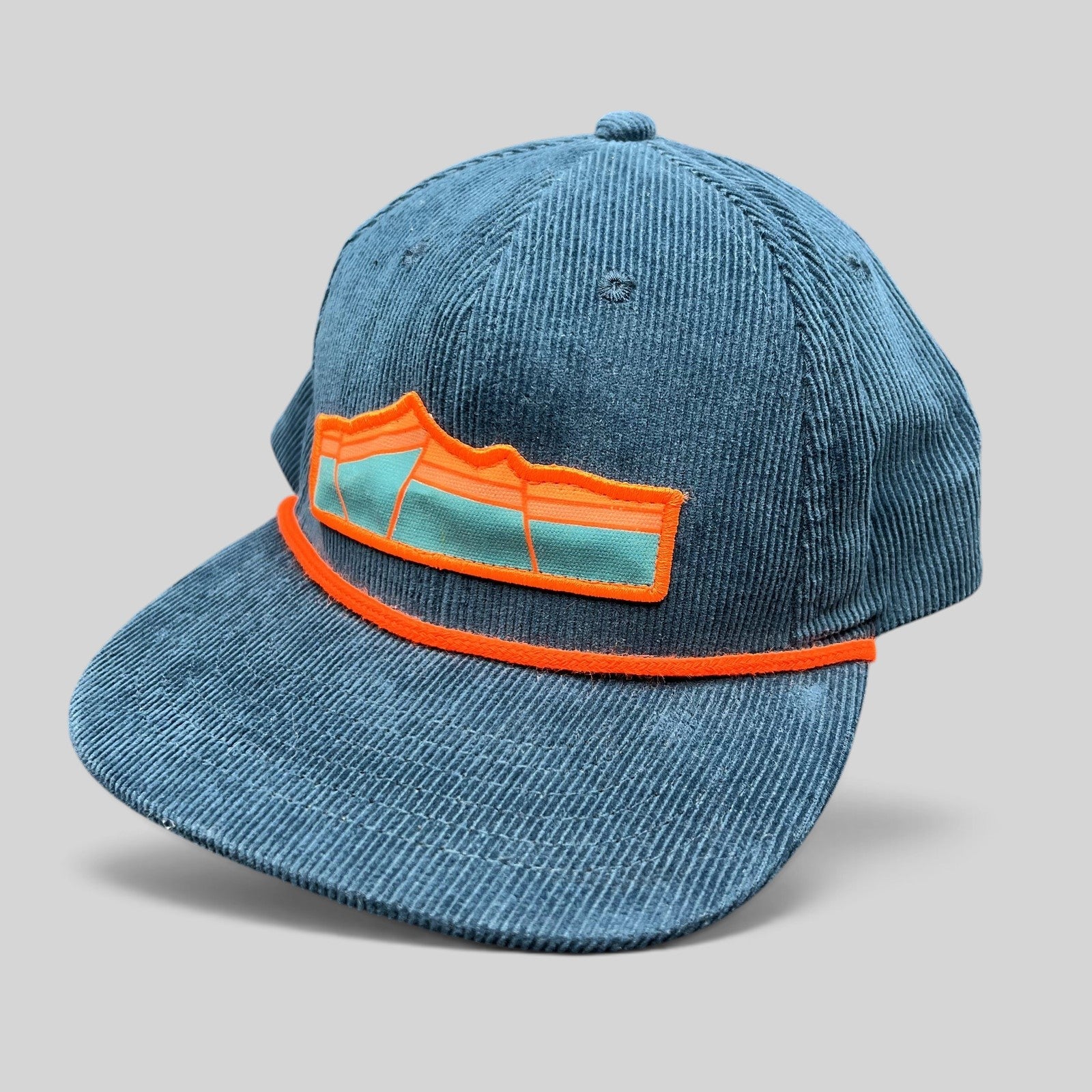 Raree Finds Sendero Provisions Co blue corduroy snapback hat with orange rope detail and mountain patch logo