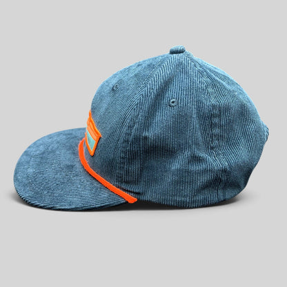 Raree Finds Sendero Provisions Co blue corduroy snapback hat with a bright orange rope detail and front patch logo.
