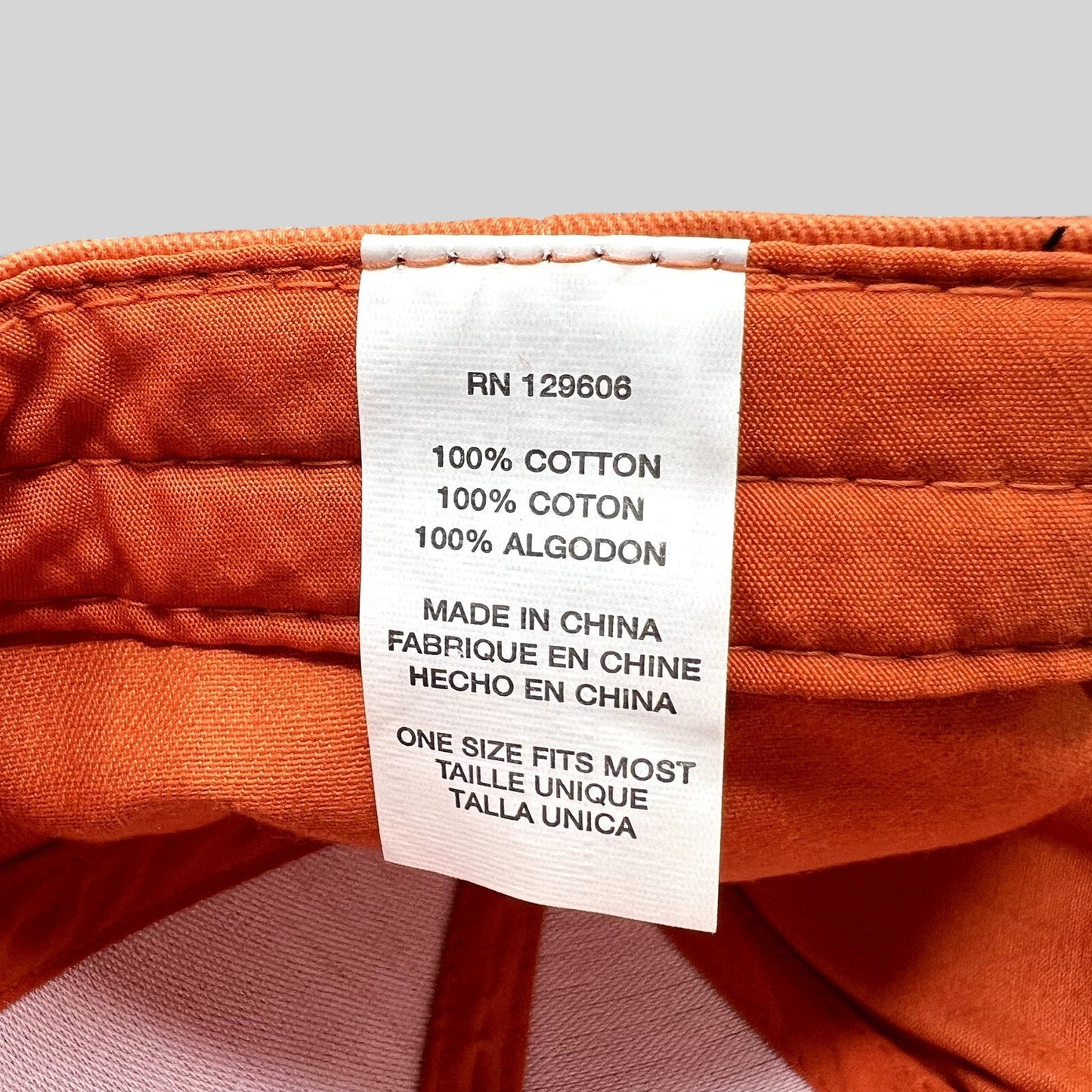 Raree Finds Shock Top hat interior care label showing 100 percent cotton material and one size fits most sizing