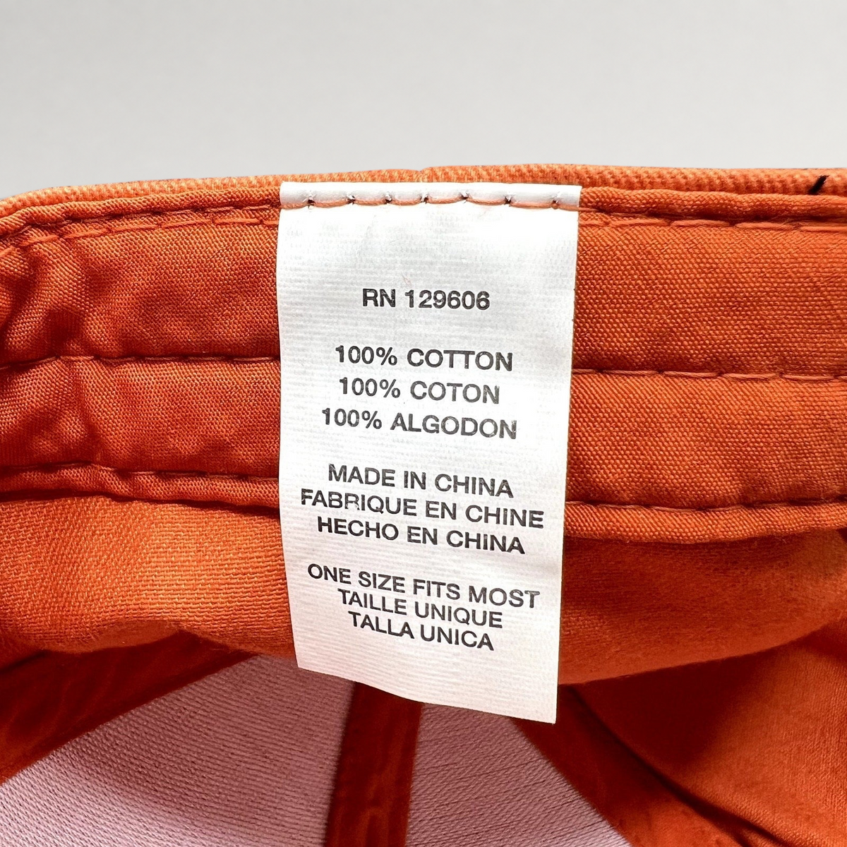 Raree Finds Shock Top hat interior care label showing 100 percent cotton material and one size fits most sizing