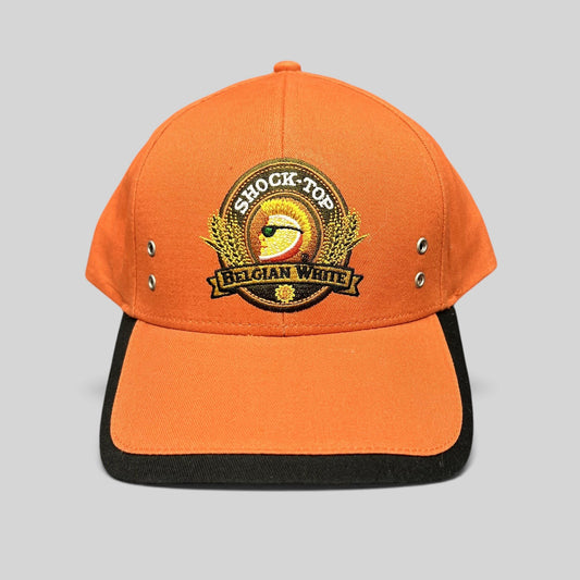 Raree Finds Shock Top Belgian White orange cotton strapback hat with embroidered citrus mascot logo and black brim.