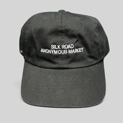 Raree Finds black Yupoong dad cap with white Silk Road Anonymous Market embroidery on the unstructured cotton crown.