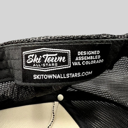 Raree Finds Ski Town All-Stars trucker hat interior label showing branding and Vail Colorado design details