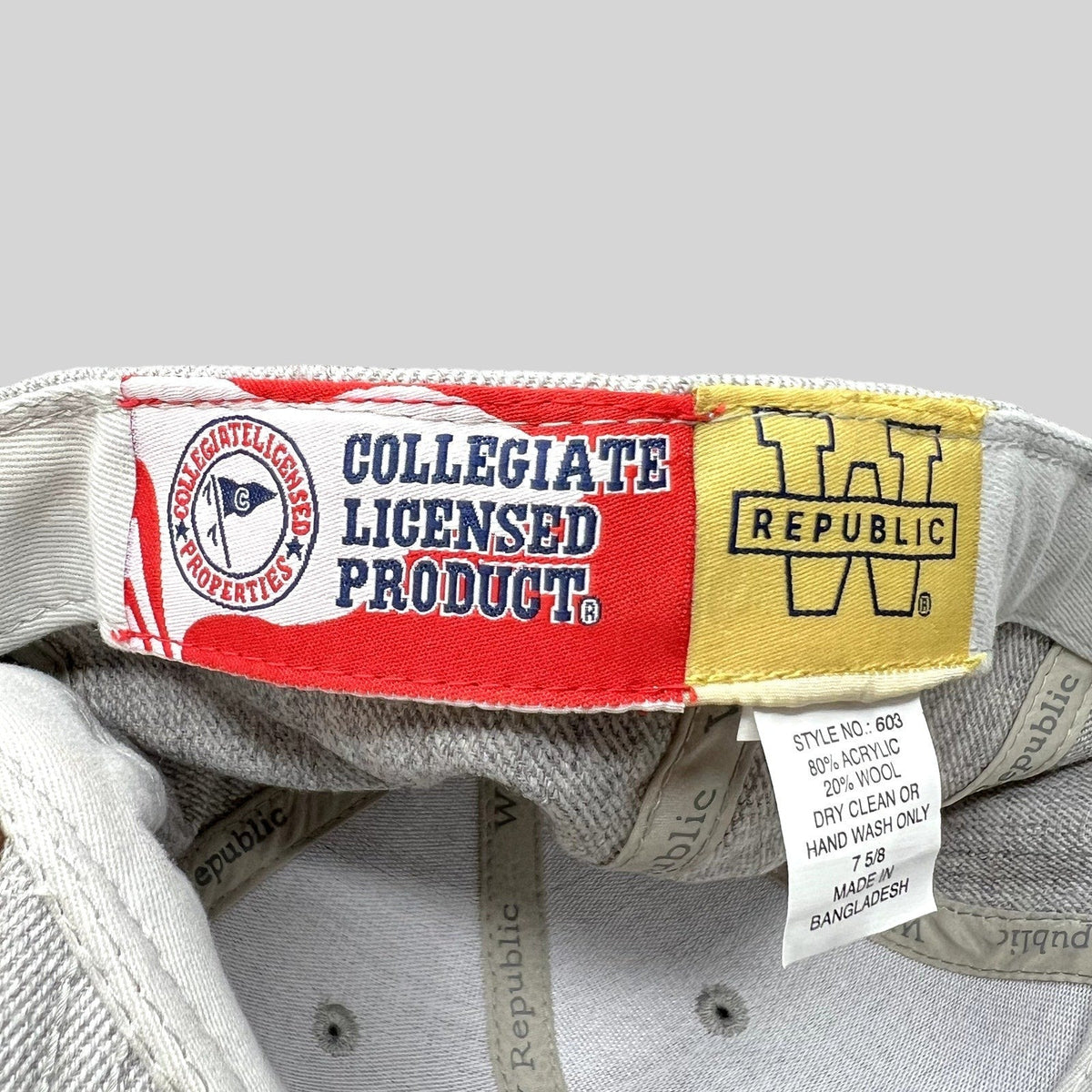 Raree Finds interior label of a W Republic SMU Mustangs hat showing collegiate licensed product and material tags.