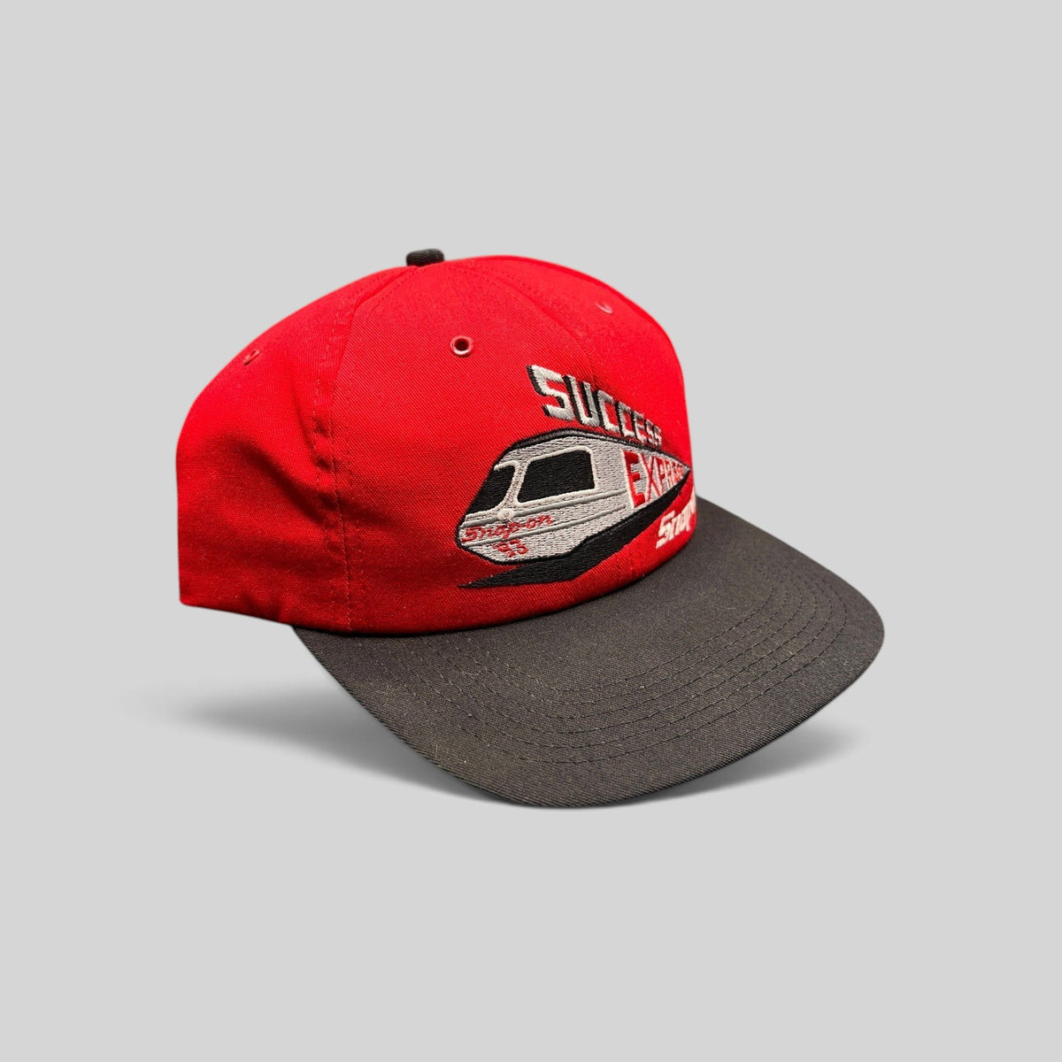Raree Finds vintage 1993 Snap-on Success Express snapback hat with red crown, black brim, and embroidered train graphic.