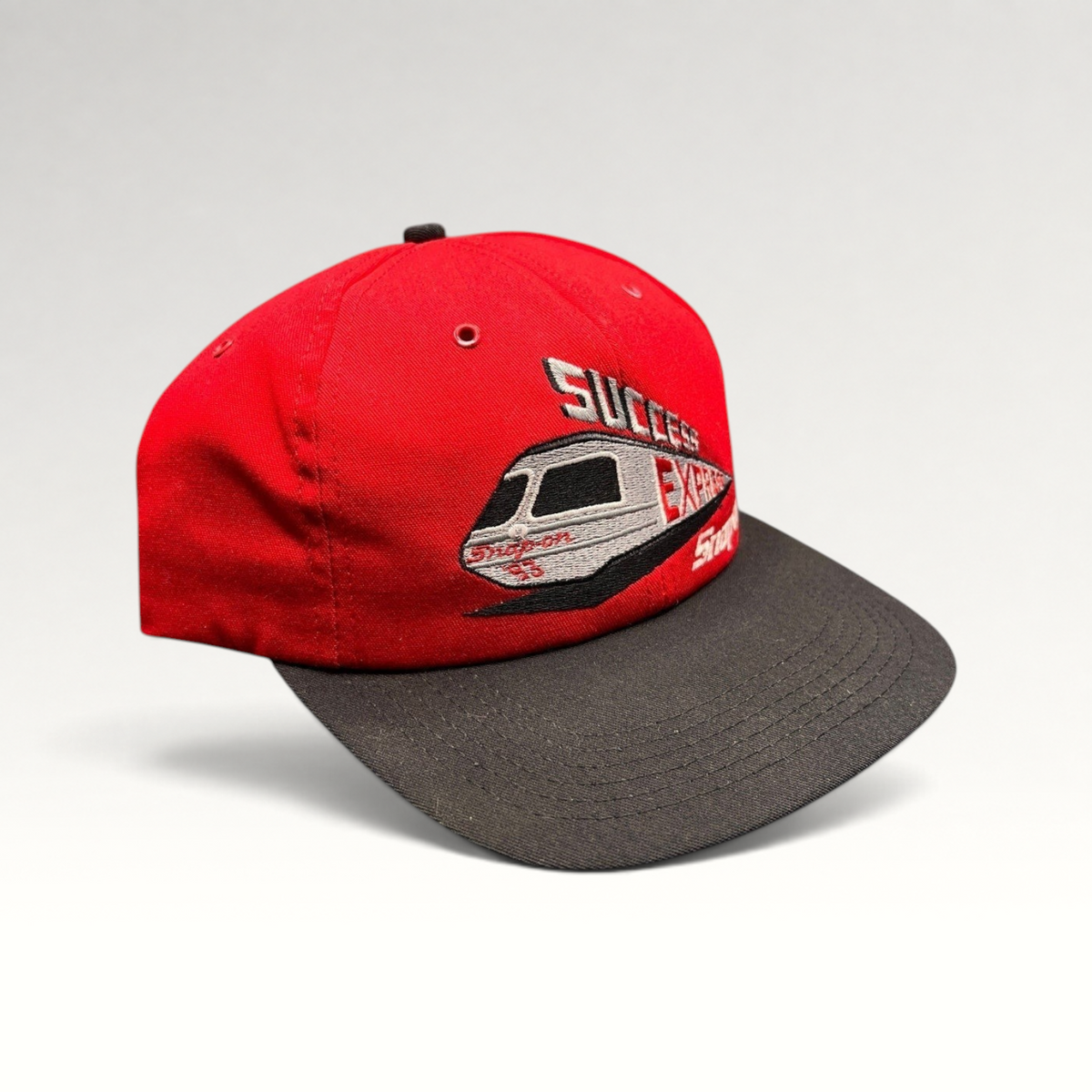 Raree Finds vintage 1993 Snap-on Success Express snapback hat with red crown, black brim, and embroidered train graphic.