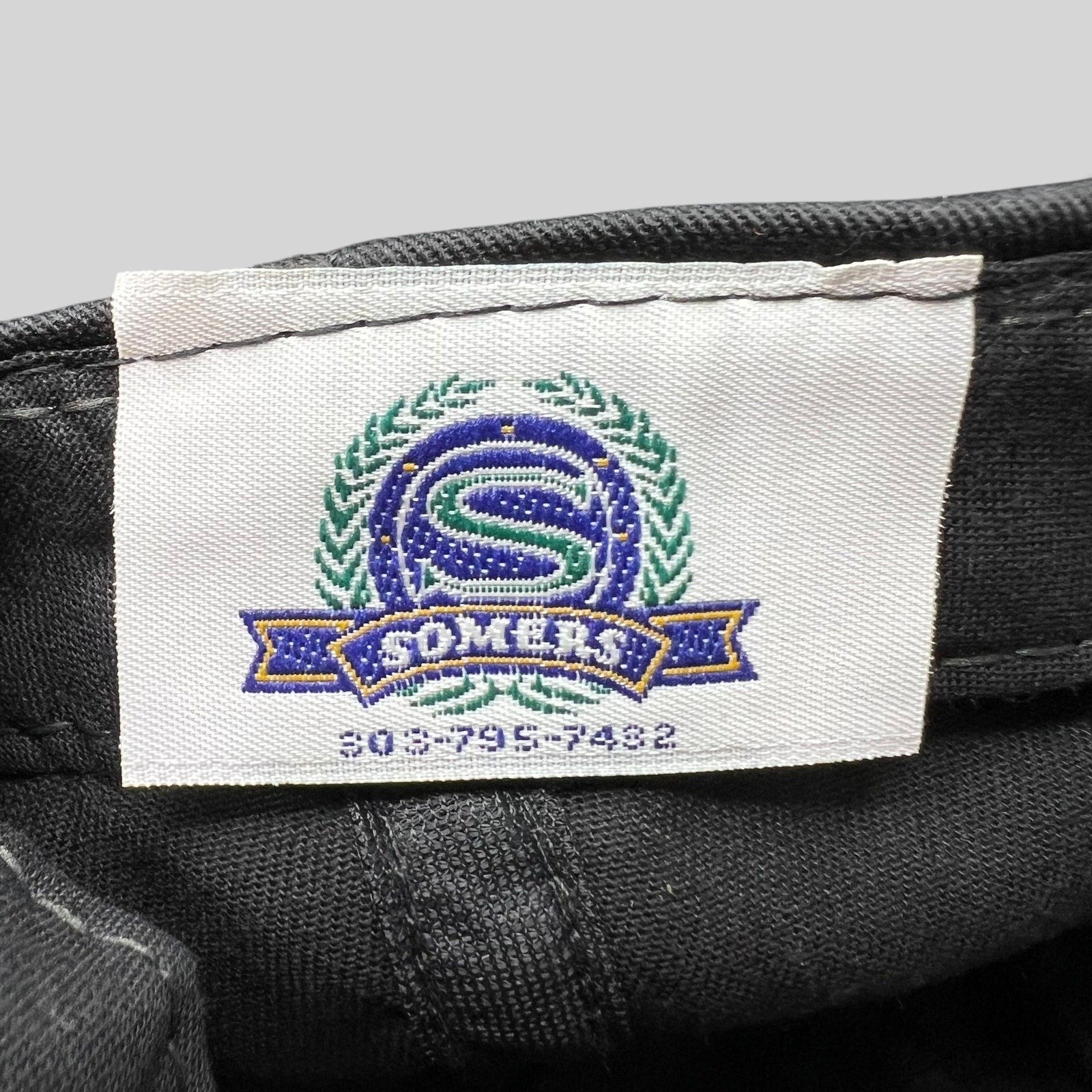 Raree Finds vintage Somers SportSouth hat interior brand tag with embroidered logo and phone number on black fabric