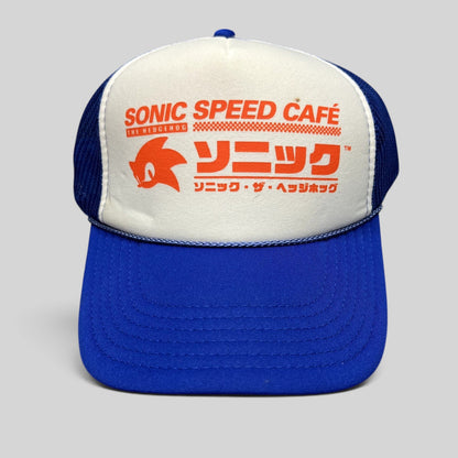 Raree Finds Sonic Speed Café trucker hat in blue and white with Japanese katakana and Sonic silhouette graphic.