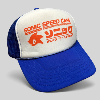Raree Finds Sonic Speed Café trucker hat with white foam front, blue mesh back, and orange Japanese Sonic logo graphic.