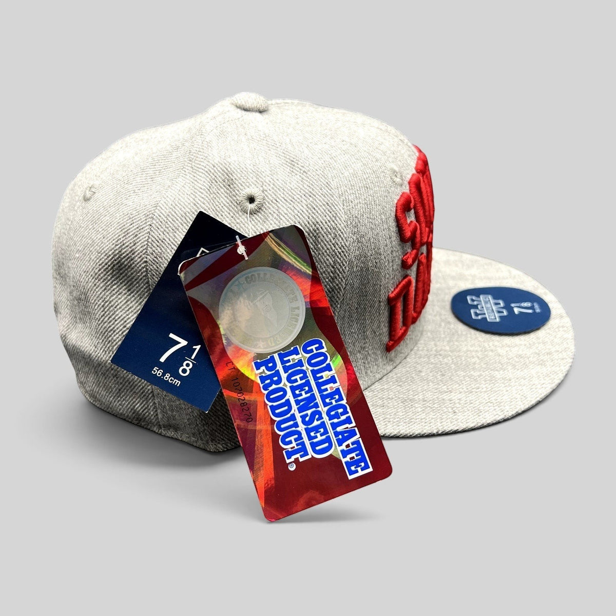 Raree Finds South Dakota fitted hat in heather gray with raised red embroidery and original collegiate tags attached.