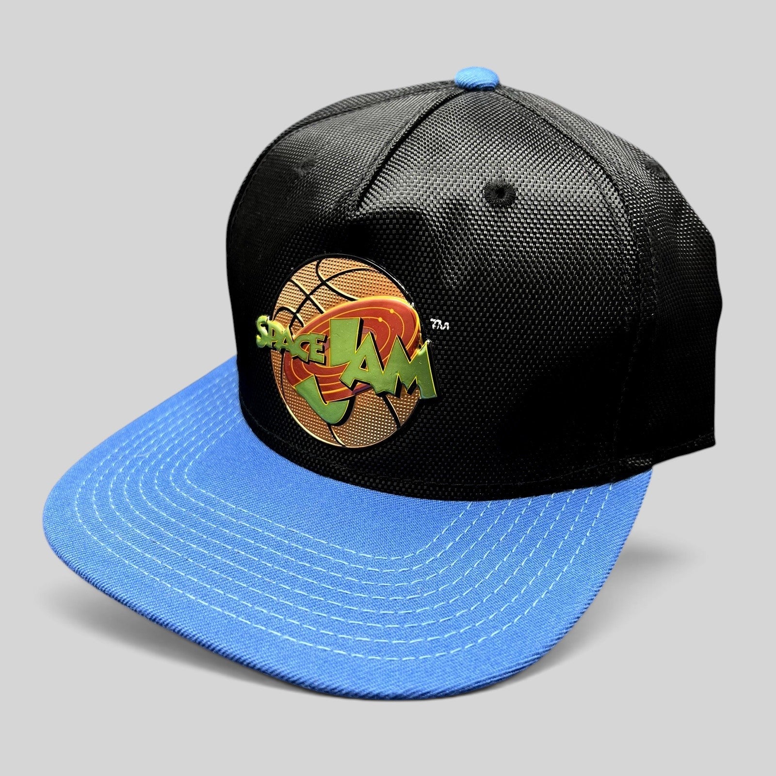 Raree Finds 2016 Space Jam snapback hat featuring a textured black crown, bright blue flat brim, and embroidered logo.
