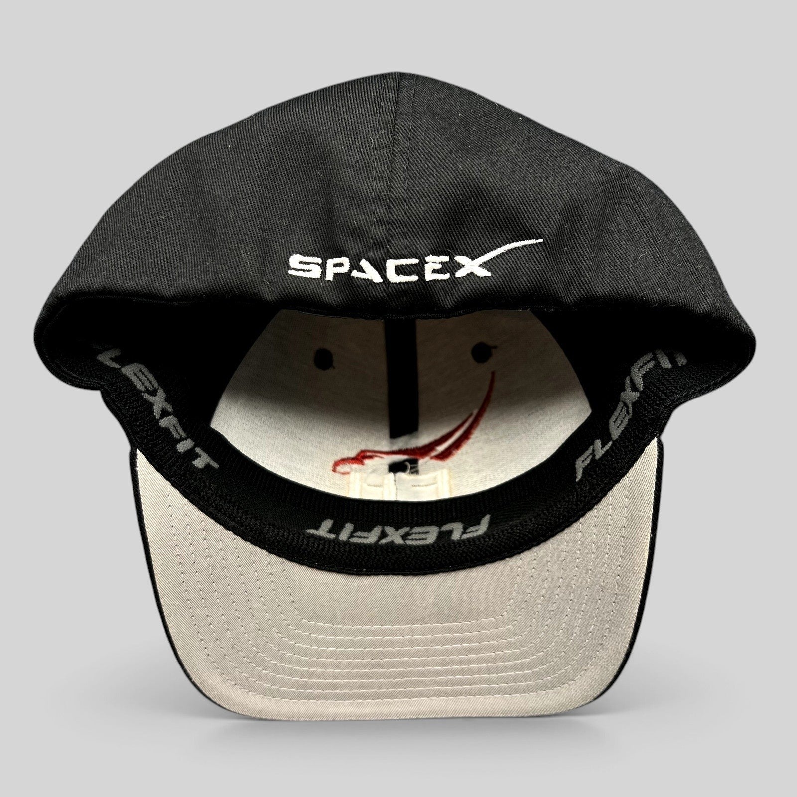 Raree Finds SpaceX Falcon Heavy Flexfit hat interior showing branded sweatband and embroidered logo on black crown