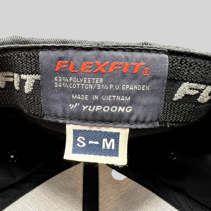 Raree Finds SpaceX Falcon Heavy hat interior label showing Yupoong Flexfit branding and size S/M tag
