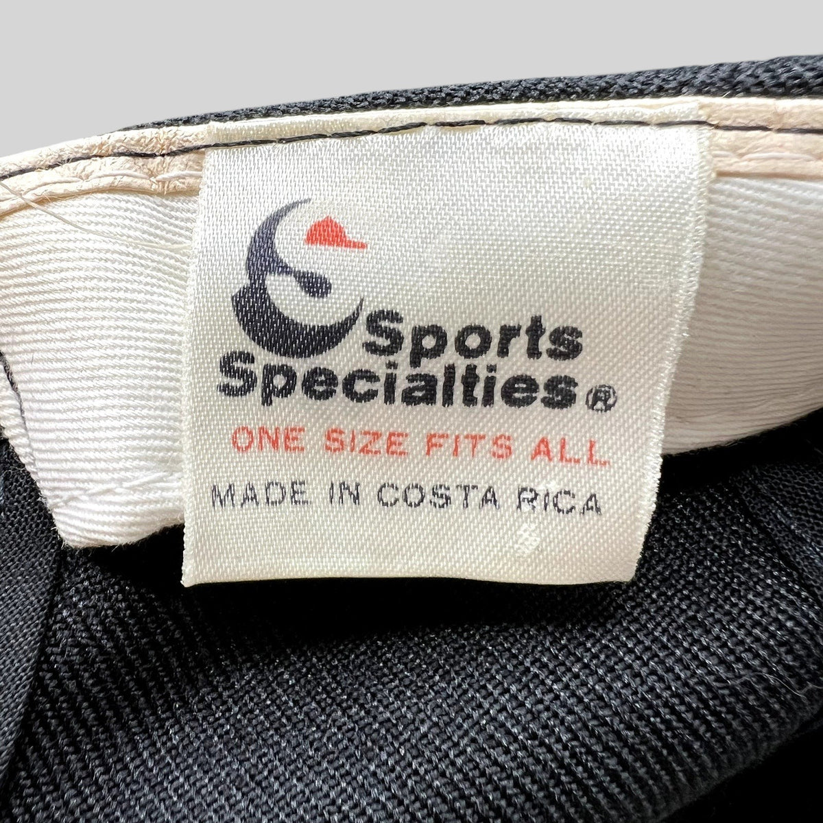 Raree Finds vintage Sports Specialties snapback hat interior tag showing Made in Costa Rica branding