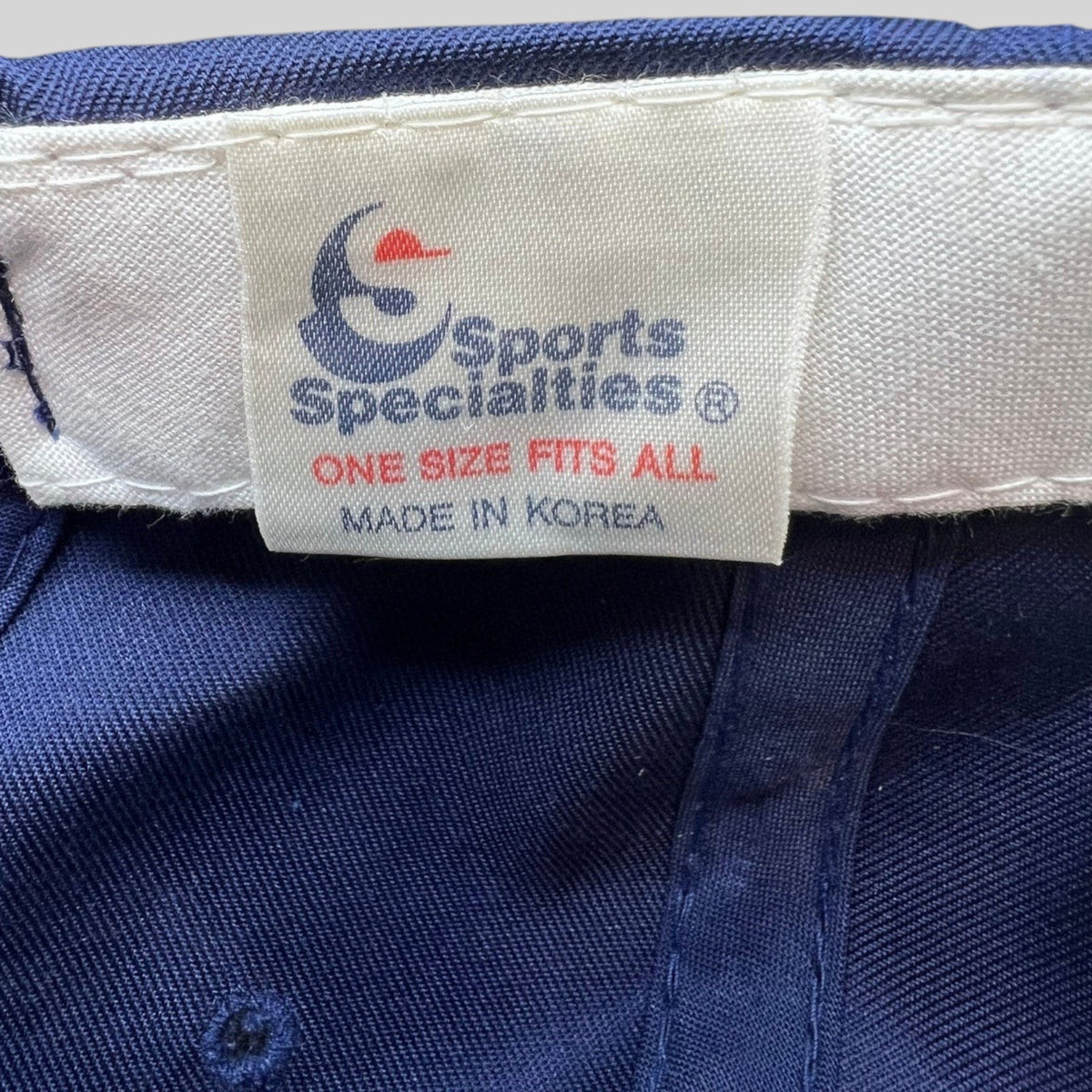 Raree Finds vintage Sports Specialties hat interior label showing Made in Korea and one size fits all text