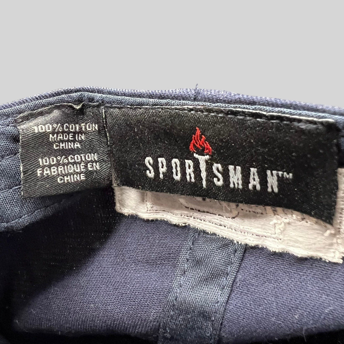 Raree Finds navy blue cotton Sportsman brand interior tag from a God Friended Me production strapback hat