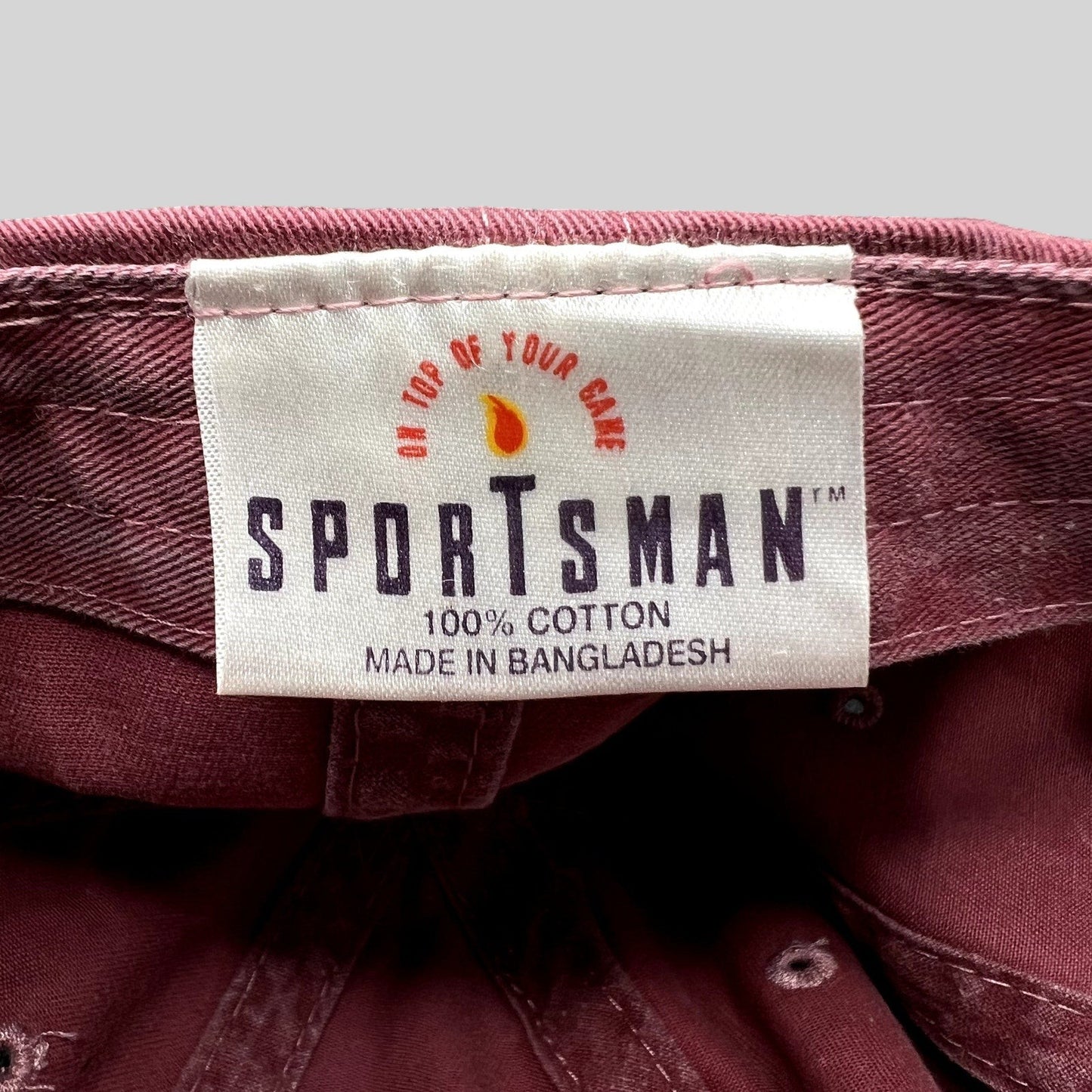 Raree Finds vintage Sportsman maroon cotton dad cap interior label showing 100% cotton and brand logo