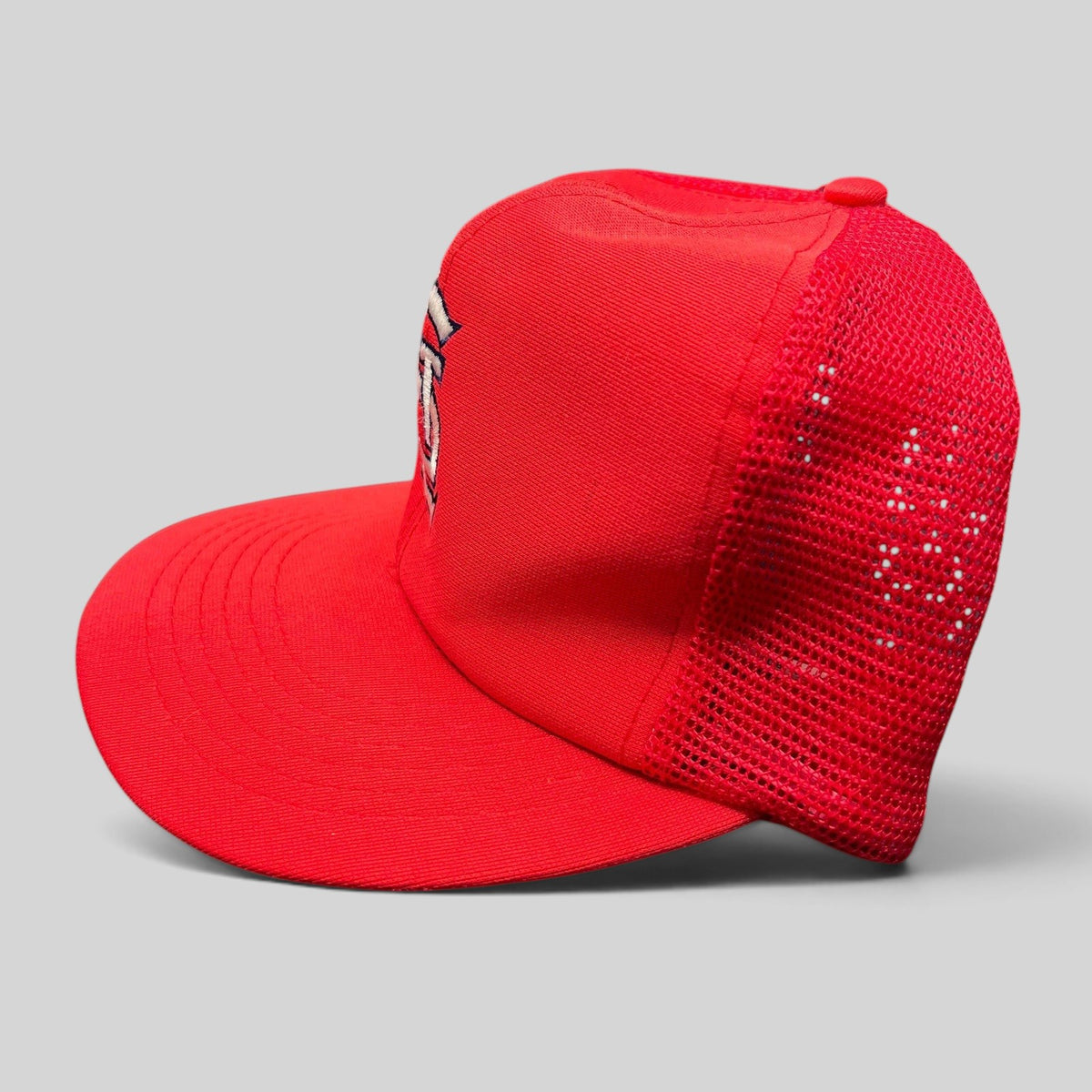 Raree Finds vintage St. Louis Cardinals red mesh snapback hat with white STL logo and green undervisor, side profile.
