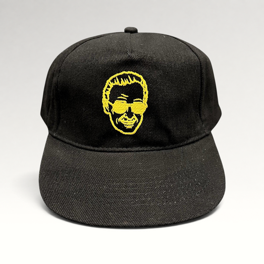 Raree Finds black strapback hat featuring gold embroidered Stan Lee portrait from 2019 Riyadh SuperCon event.