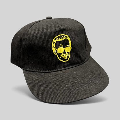 Raree Finds black strapback hat featuring gold embroidered Stan Lee portrait from 2019 Riyadh SuperCon event