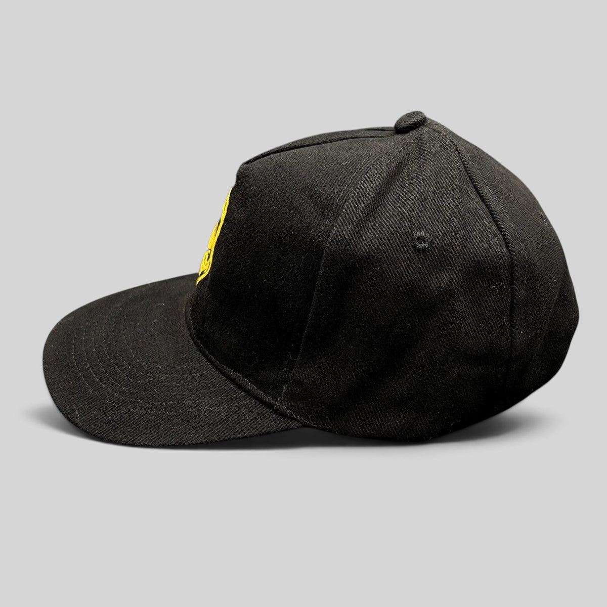 Raree Finds black strapback hat featuring gold embroidered Stan Lee portrait from 2019 SuperCon Riyadh convention.