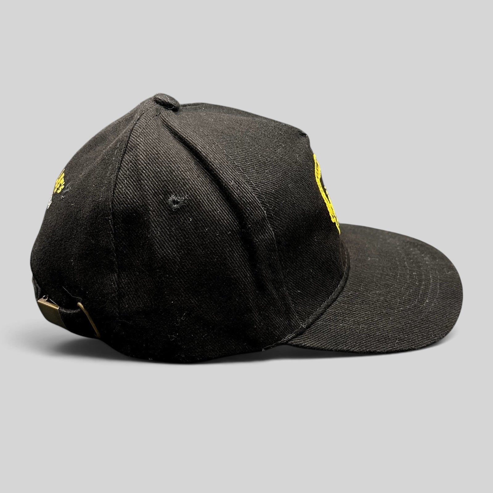 Raree Finds black strapback hat with gold Stan Lee embroidery from the 2019 SuperCon Riyadh event, side profile view.